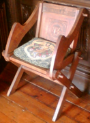 A reproduction chair, also in the Bishop's Palace, Wells Src